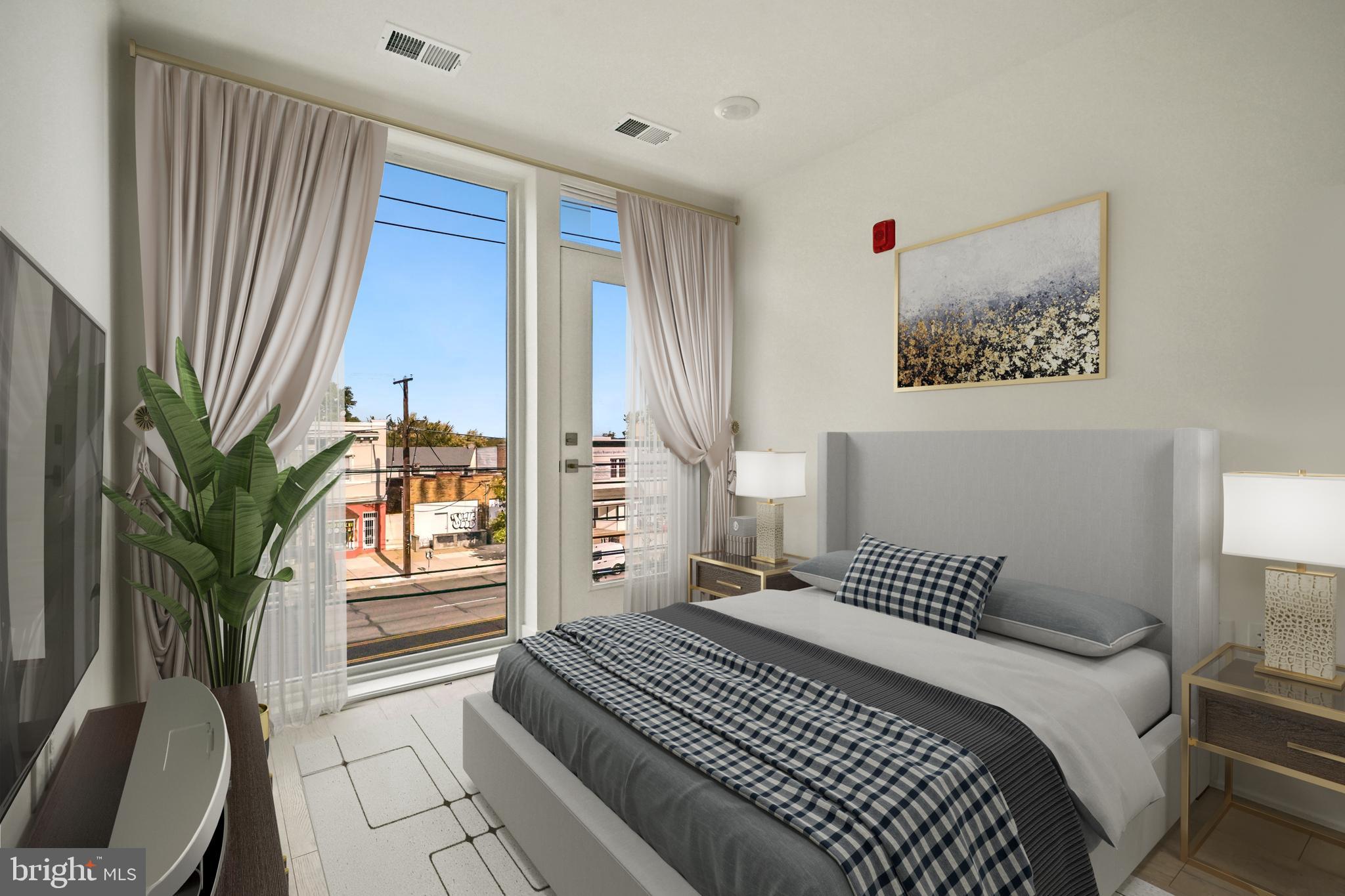 2027 Rhode Island Avenue Northeast, Unit 401 Washington, DC 20018 - Photo 15 of 29 a bedroom with a large bed and a potted plant