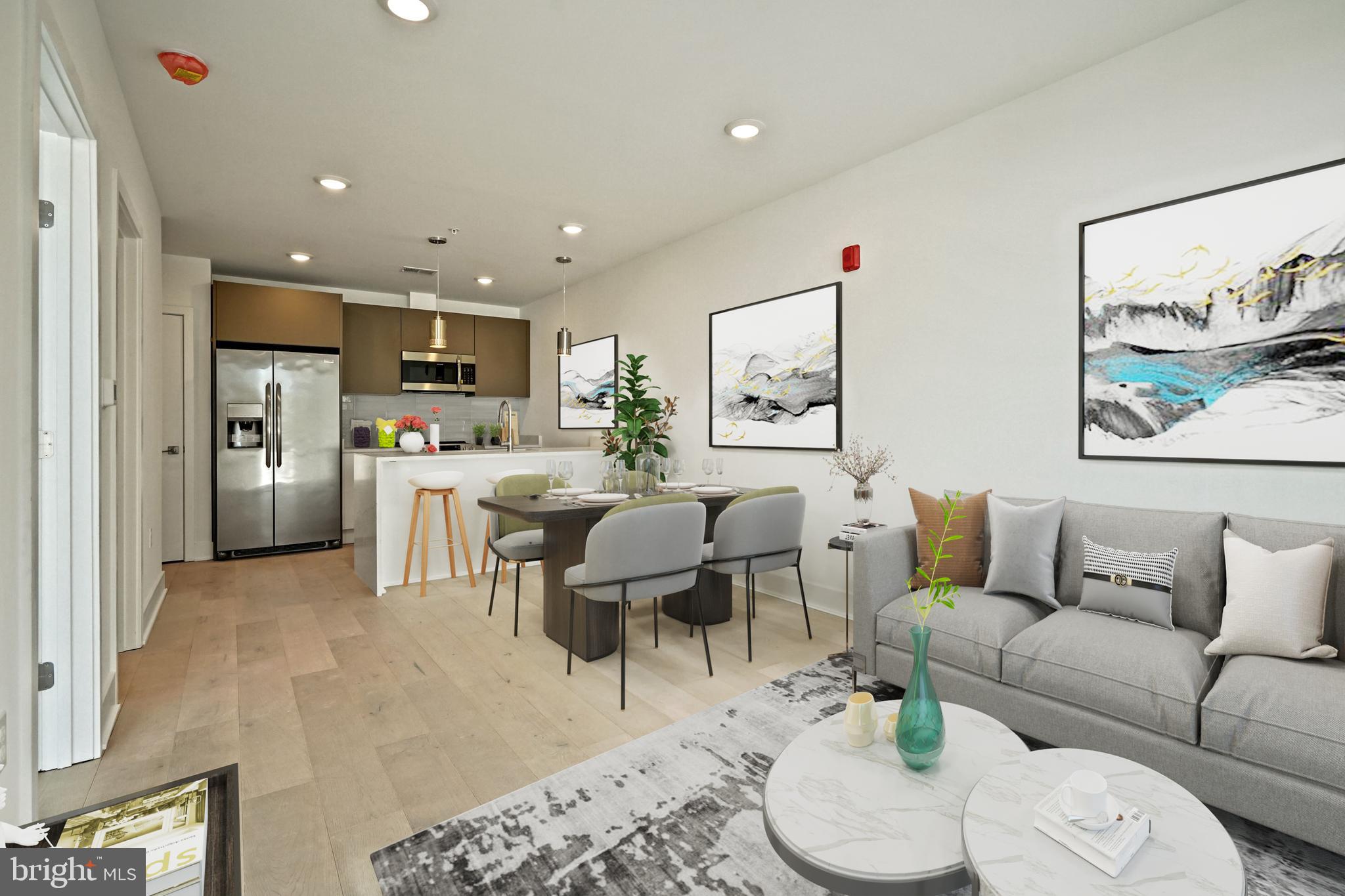 2027 Rhode Island Avenue Northeast, Unit 401 Washington, DC 20018 - Photo 2 of 29 a living room with furniture and kitchen view