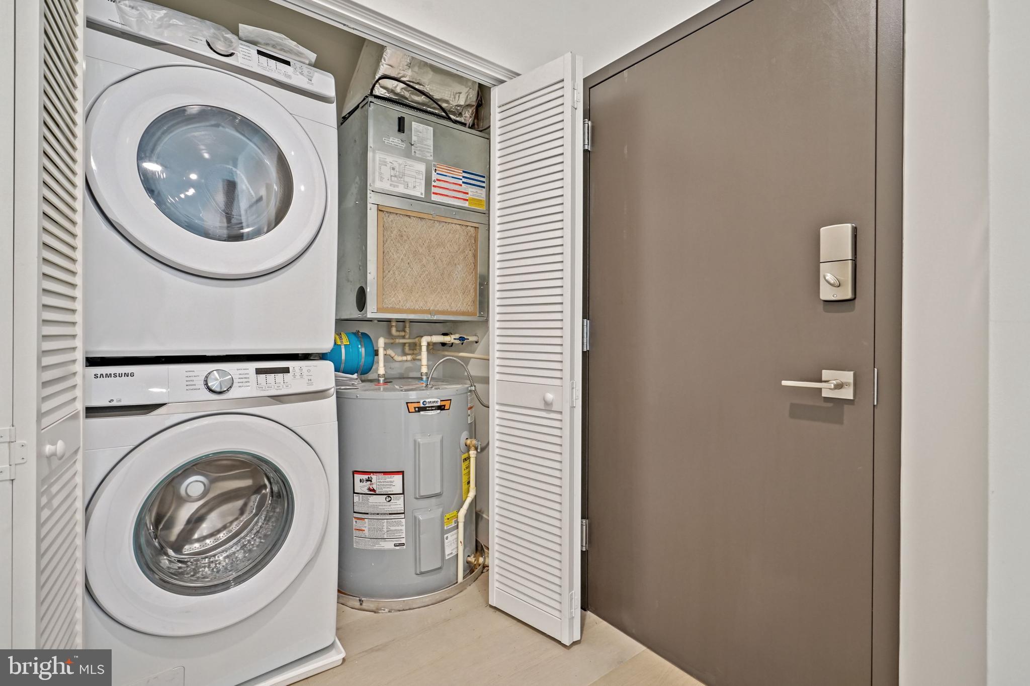 2027 Rhode Island Avenue Northeast, Unit 401 Washington, DC 20018 - Photo 23 of 29 a view of a hallway with washer and dryer