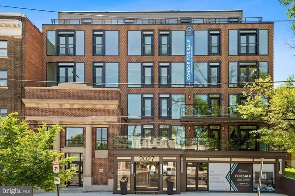 a front view of a building with glass windows