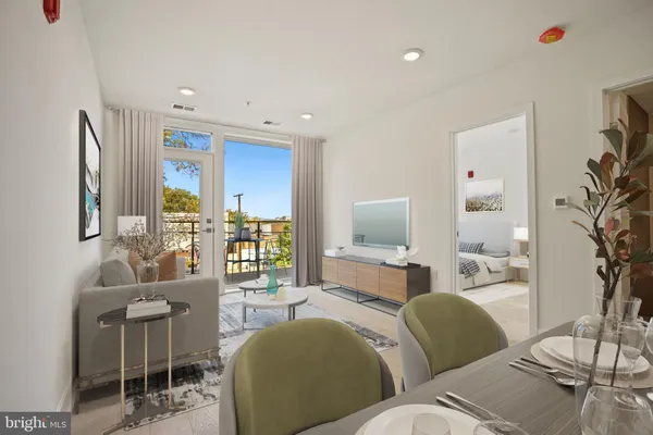 a living room with furniture kitchen view and a large window