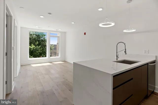 a kitchen with a sink and a window
