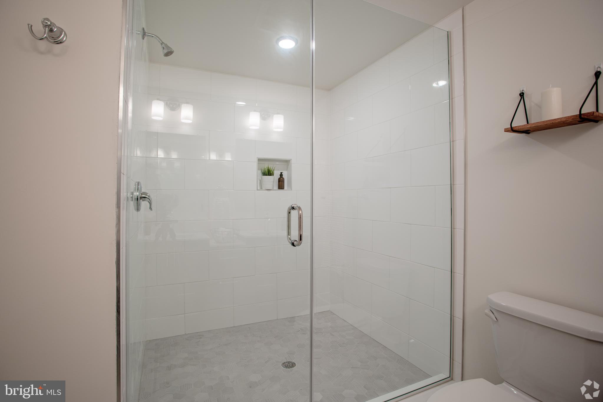 2612 Braddock Street, Unit 1 Philadelphia, PA 19125 - Photo 17 of 17 a bathroom with a shower