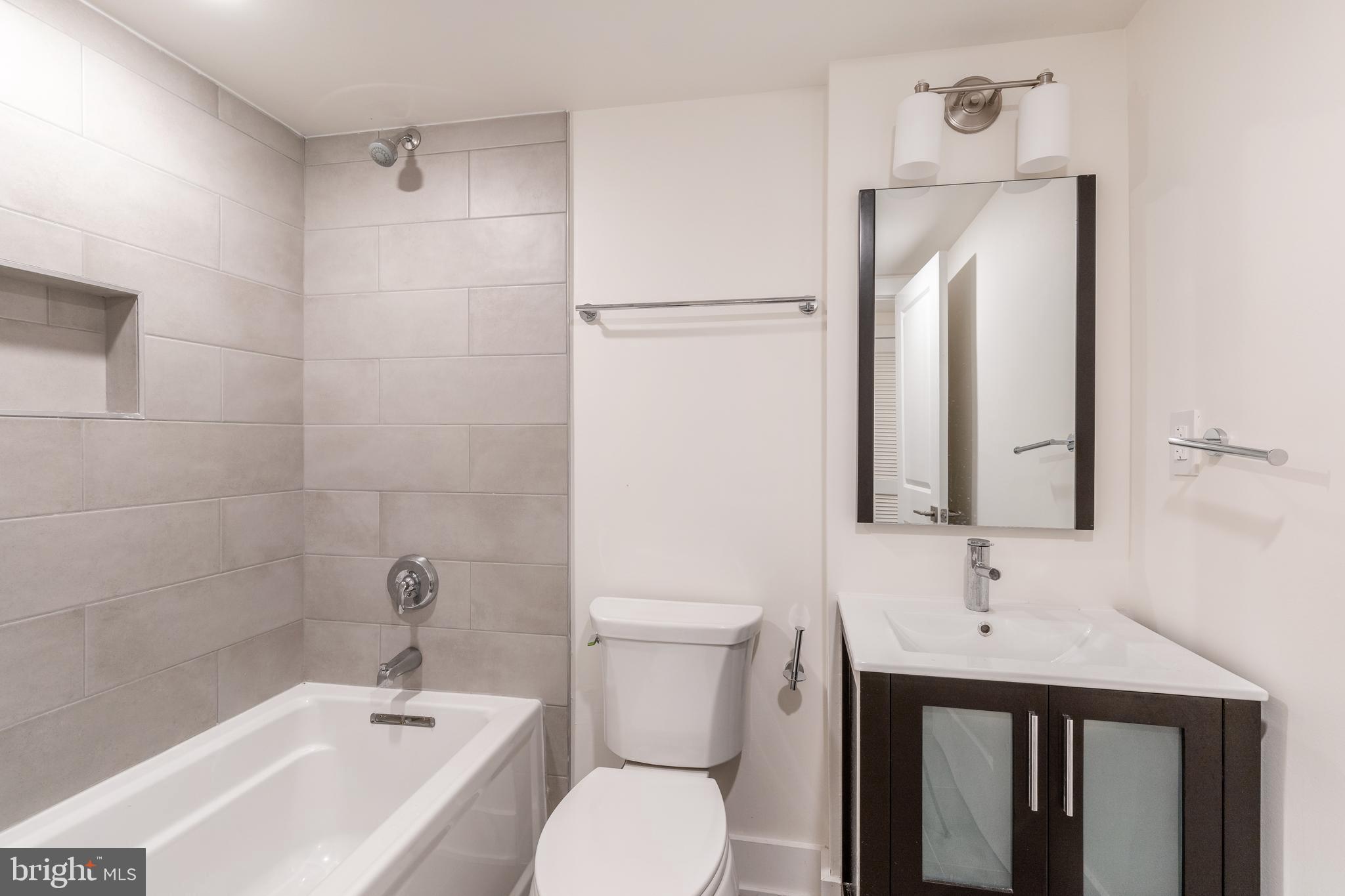 2612 Braddock Street, Unit 1 Philadelphia, PA 19125 - Photo 9 of 17 a bathroom with a sink toilet and shower