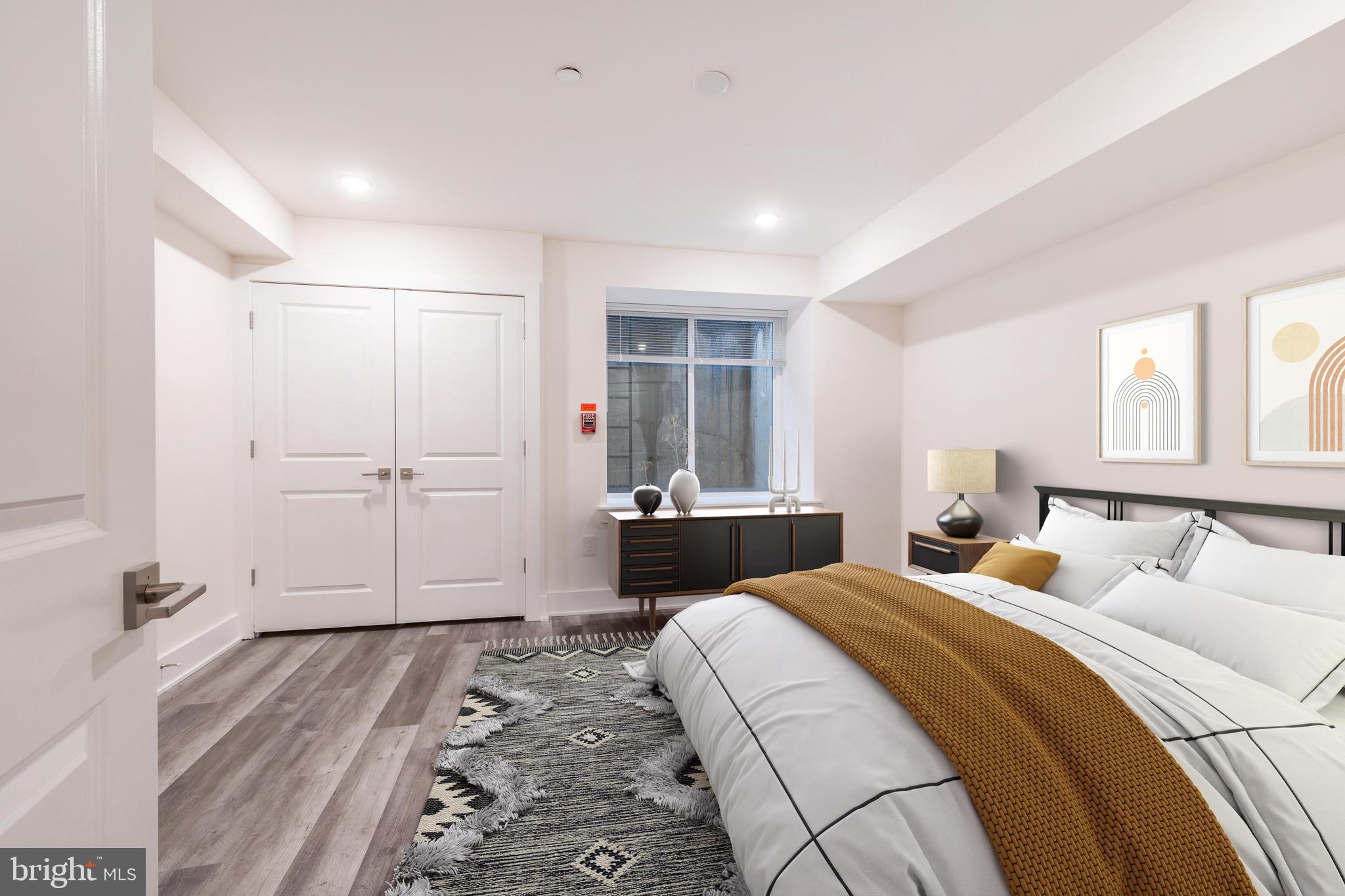 2612 Braddock Street, Unit 1 Philadelphia, PA 19125 - Photo 10 of 17 a bedroom with a bed and a window