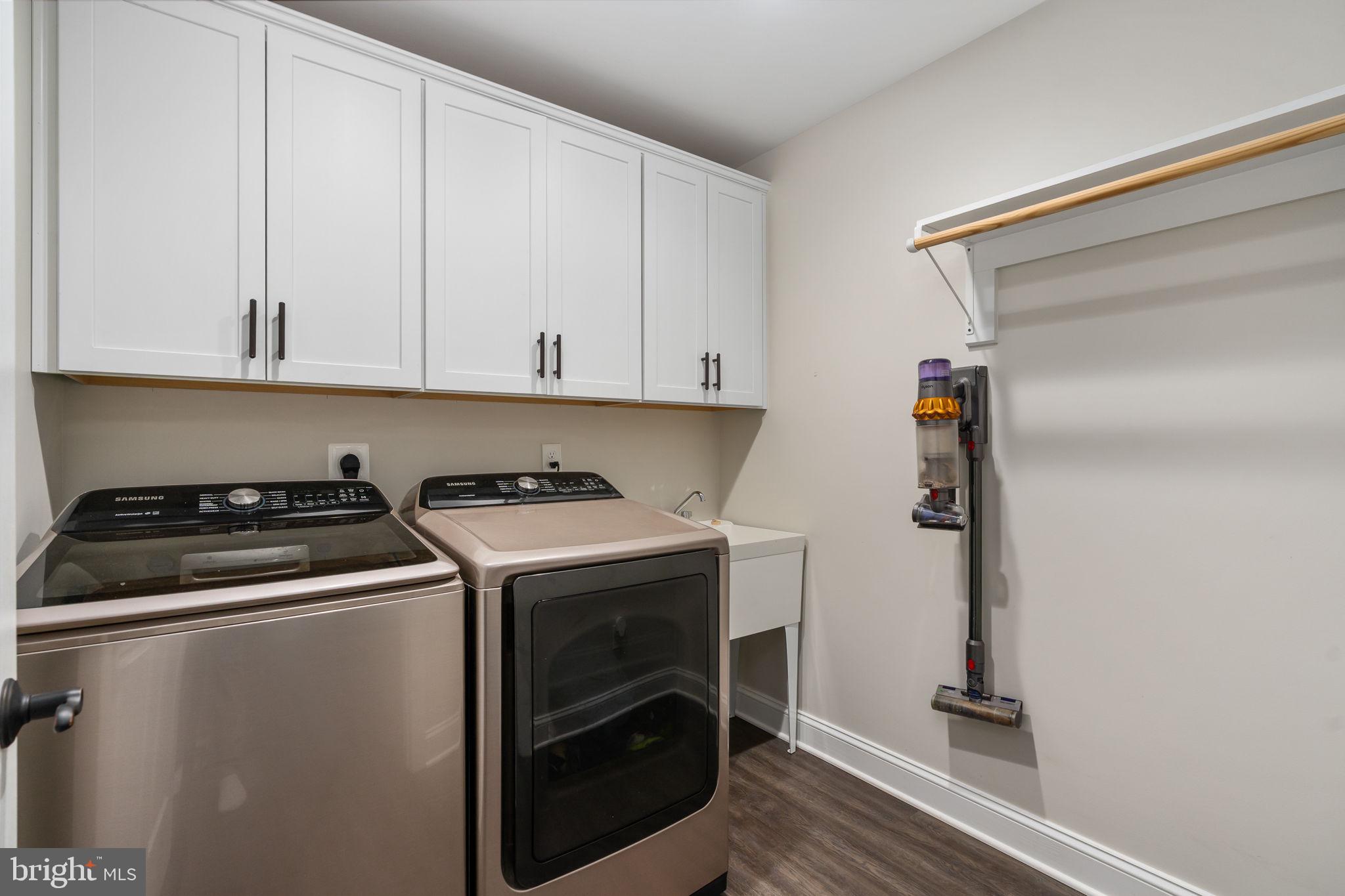 10514 Hart Court Culpeper, VA 22701 - Photo 12 of 34 a view of washer and dryer with kitchen in the background
