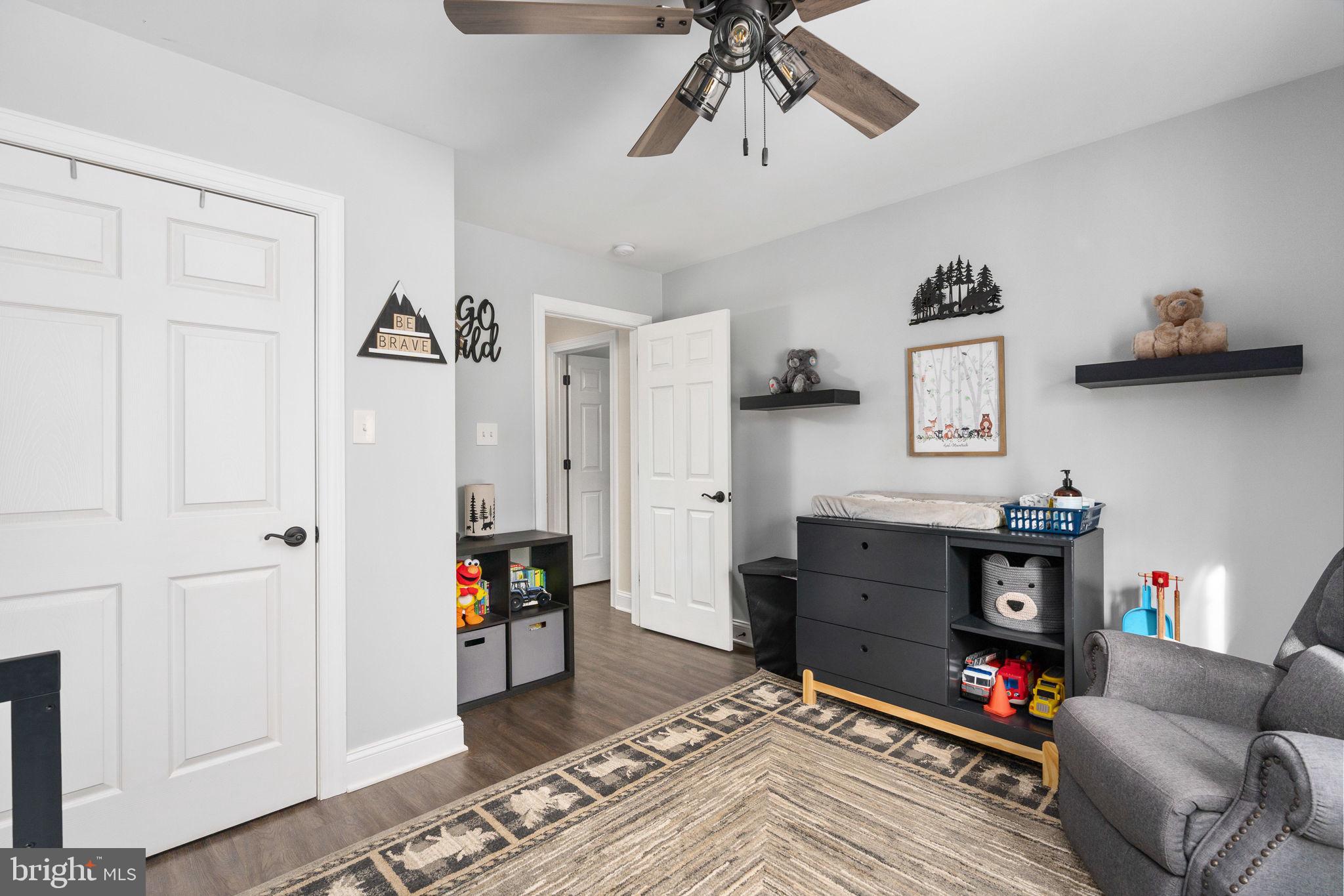 10514 Hart Court Culpeper, VA 22701 - Photo 22 of 34 a living room with furniture and a wooden floor