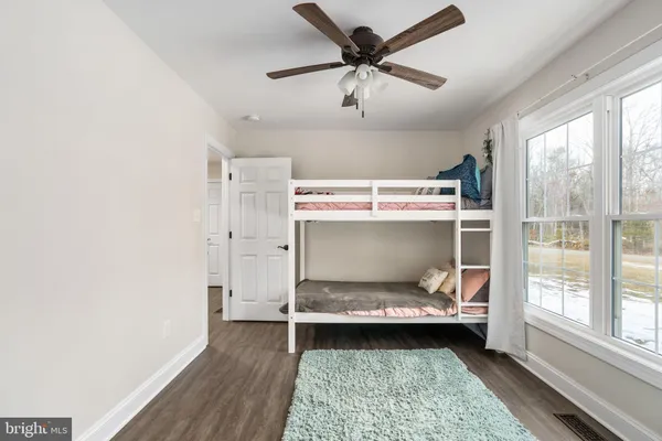 a view of a bedroom from a hallway