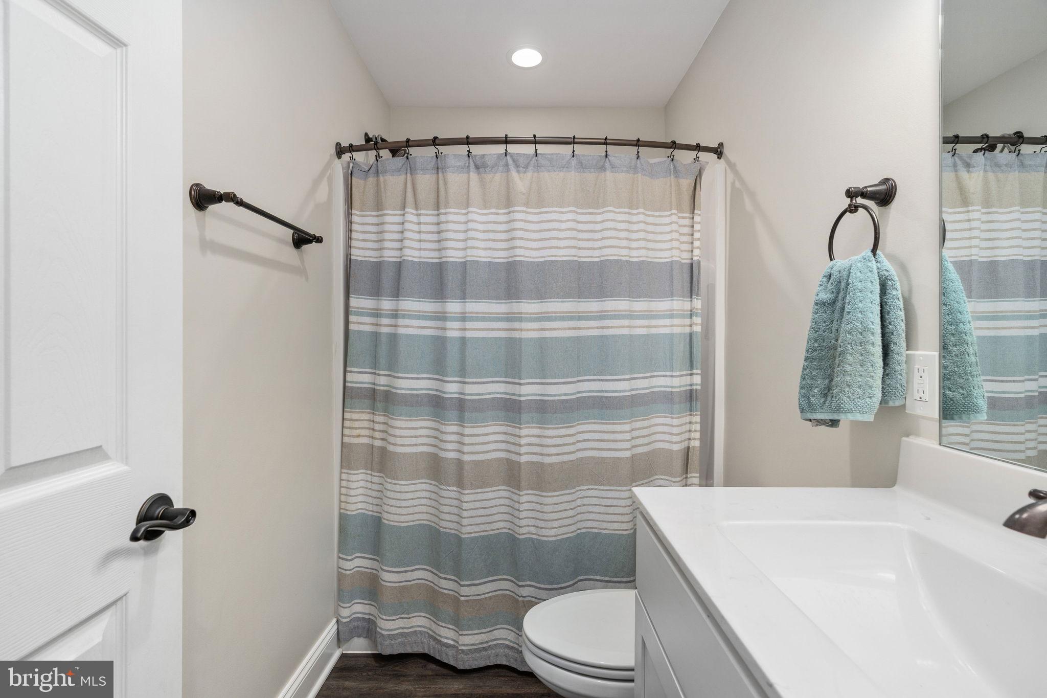 10514 Hart Court Culpeper, VA 22701 - Photo 24 of 34 a bathroom with a sink toilet and shower