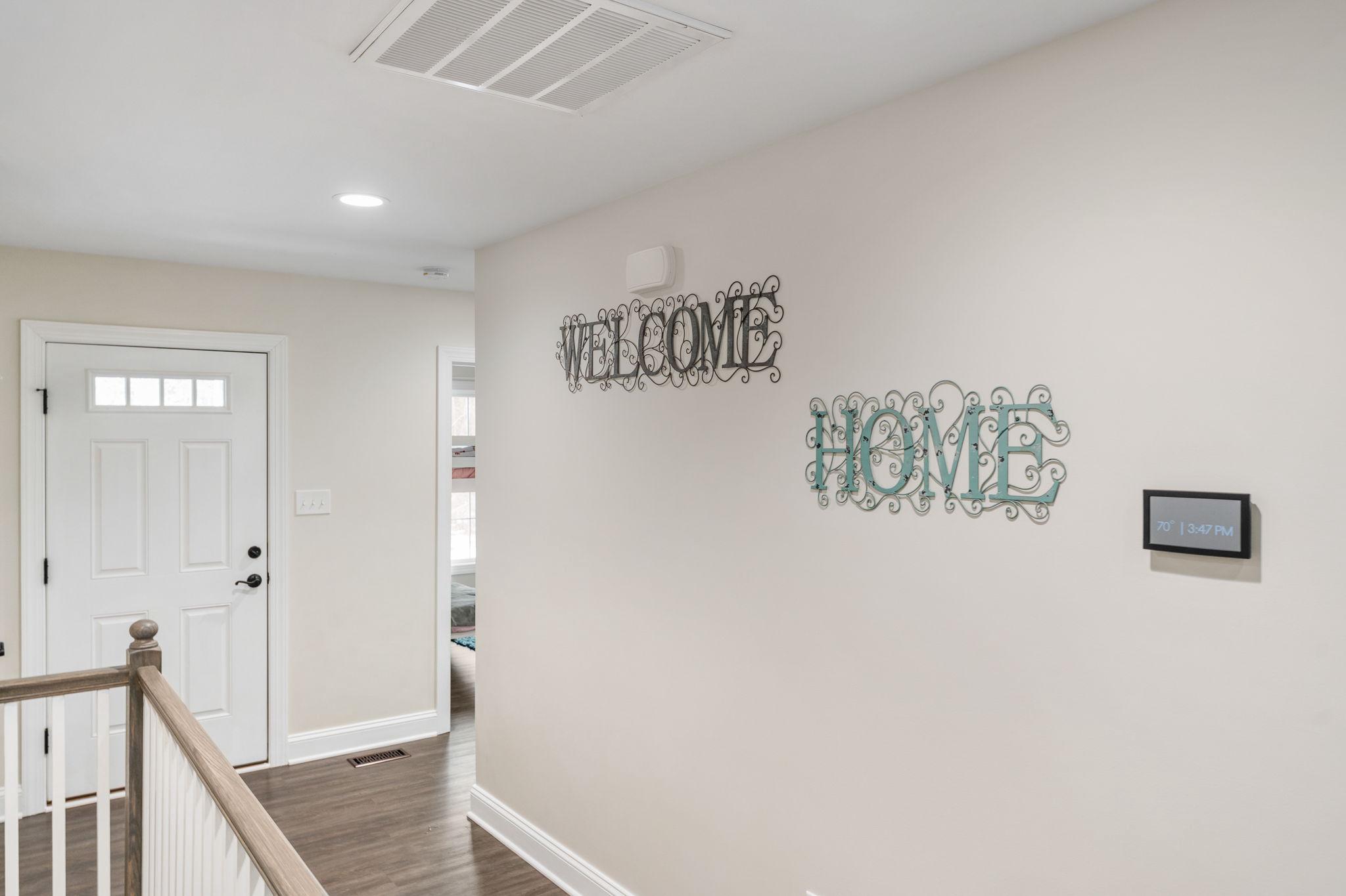 10514 Hart Court Culpeper, VA 22701 - Photo 3 of 34 a view of a hallway with a white walls