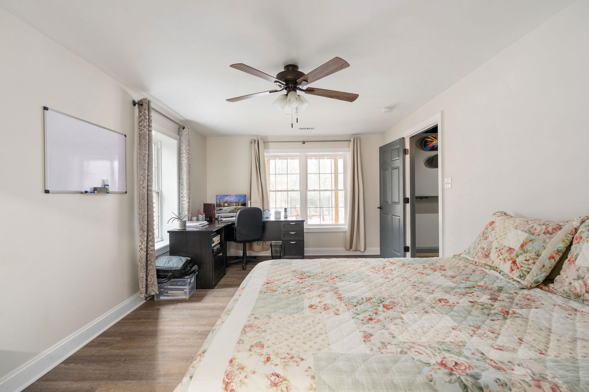 10514 Hart Court Culpeper, VA 22701 - Photo 32 of 34 a bedroom with a bed couch and a window