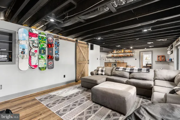 a view of a livingroom with hardwood and kitchen
