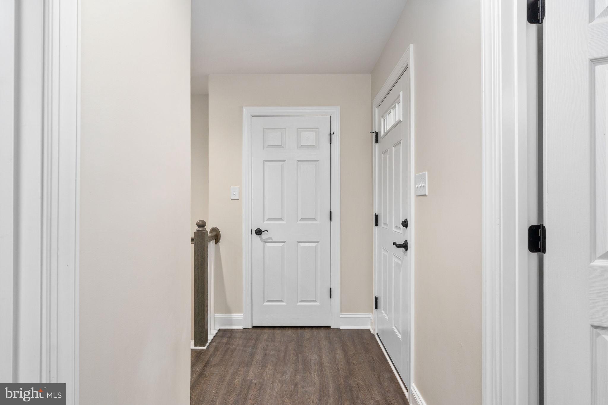 10514 Hart Court Culpeper, VA 22701 - Photo 4 of 34 a view of a hallway with wooden floor