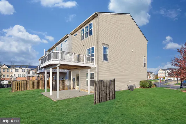 a view of a house with a yard and a garden