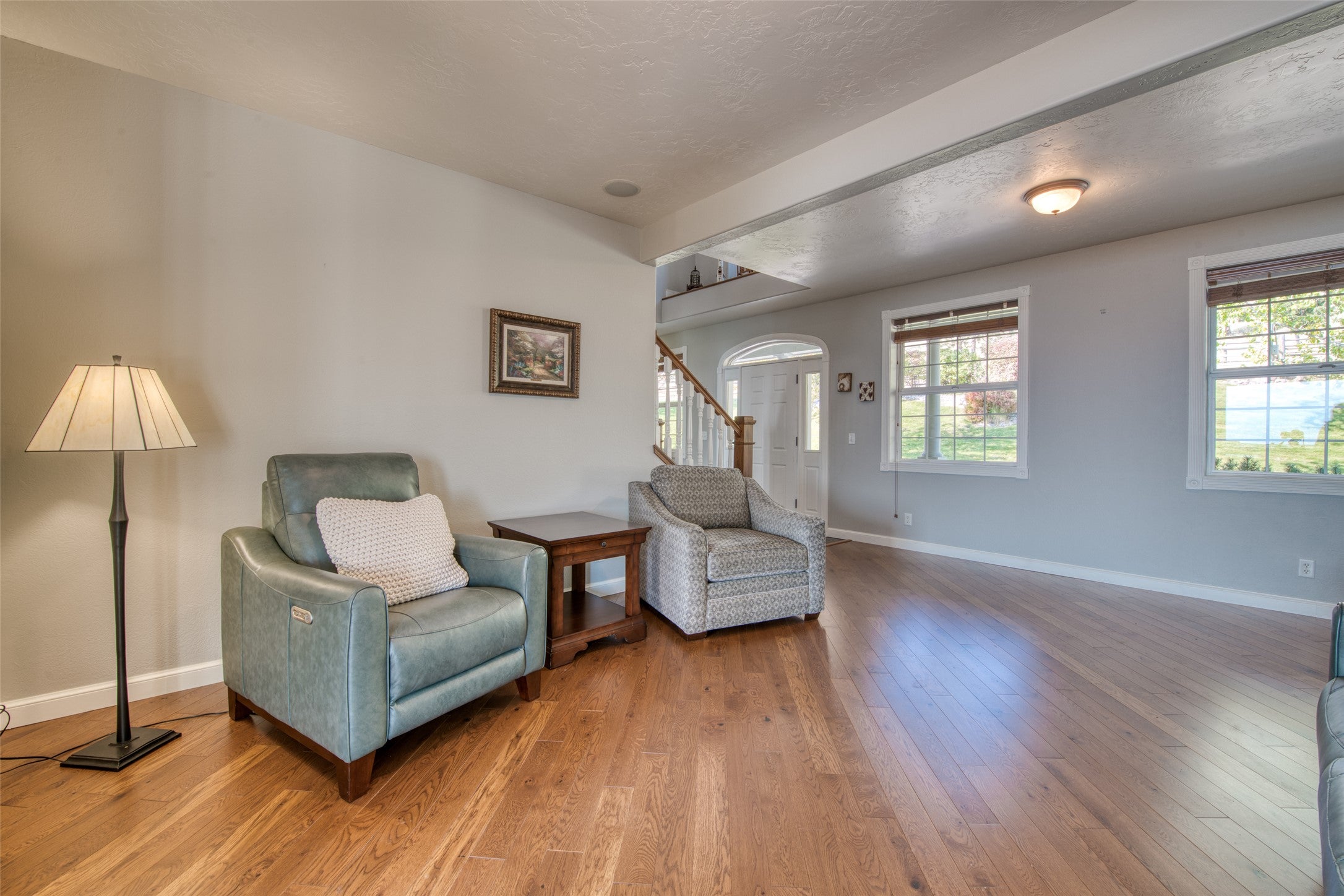 16374 Folsom Road Florence, MT 59833 - Photo 55 of 98 Sitting room with light wood-style flooring, a textured ceiling, and stairway