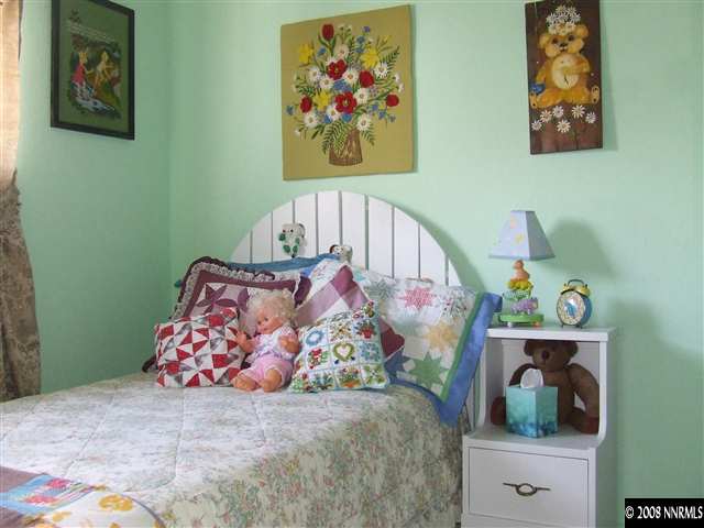 3560 Brant Street Reno, NV 89508 - Photo 7 of 9 a bedroom with bed and wooden floor