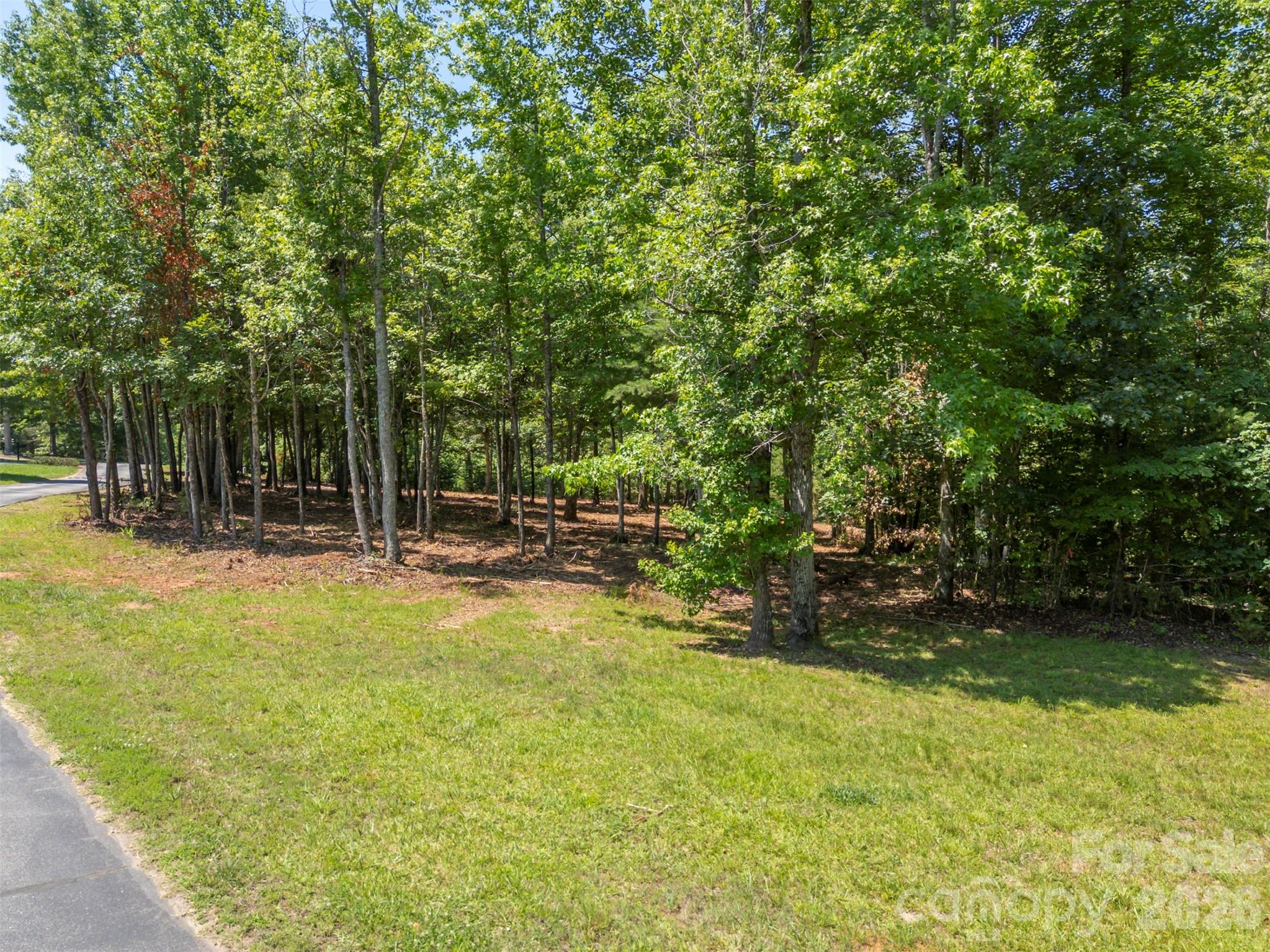 0 Doveridge Drive, Unit 66 Tryon, NC 28782 - Photo 21 of 21 a view of swimming pool with a bench and trees