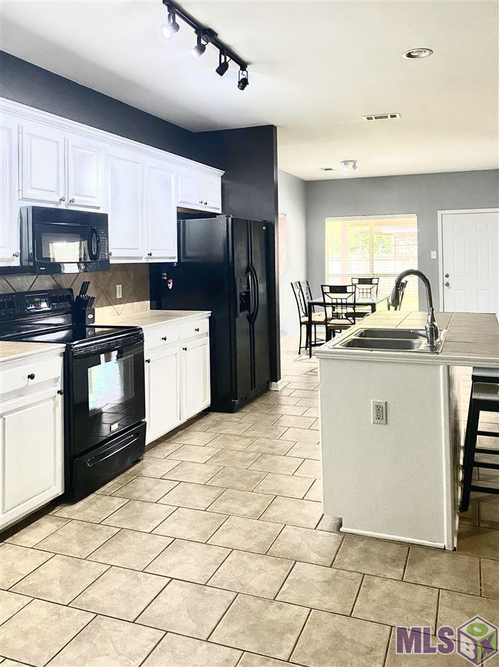 9628 Arnold Road Denham Springs, LA 70726 - Photo 3 of 10 Great kitchen with island seating and plenty storage