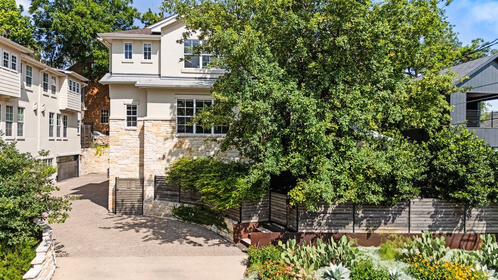 1609 Hartford Road, Unit A Austin, TX 78703 - Photo 4 of 39 Mature trees provide natural privacy to this architecturally rich exterior featuring stone and stucco finishes.