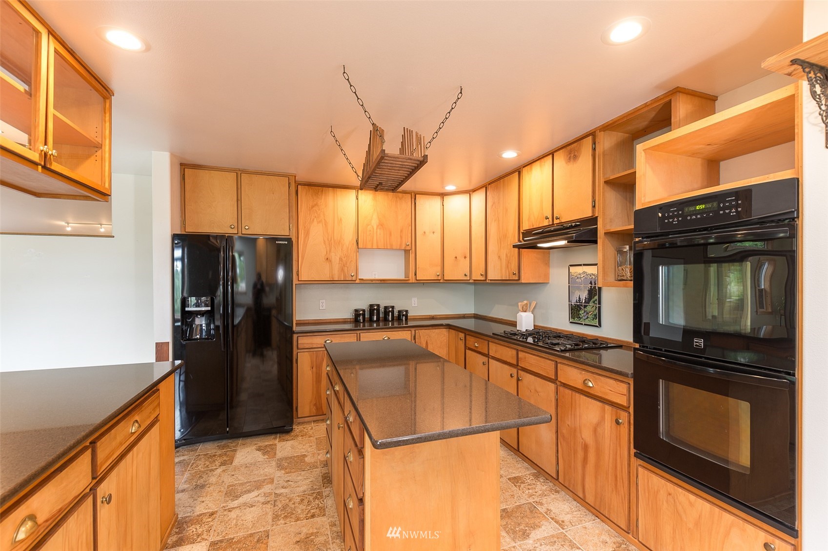 313 Applegate Lane Sequim, WA 98382 - Photo 11 of 40 a kitchen with stainless steel appliances granite countertop a refrigerator a stove top oven and sink