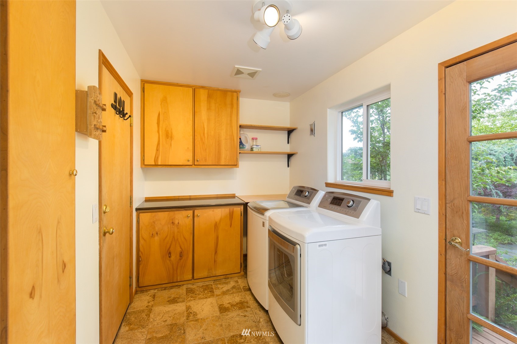 313 Applegate Lane Sequim, WA 98382 - Photo 13 of 40 a view of a kitchen with a sink dishwasher and a refrigerator