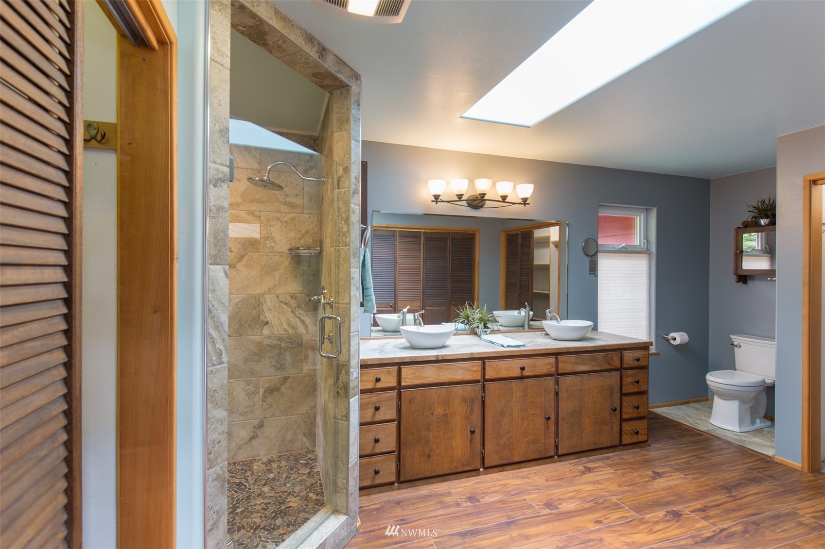 313 Applegate Lane Sequim, WA 98382 - Photo 18 of 40 a bathroom with a double vanity sink and a mirror