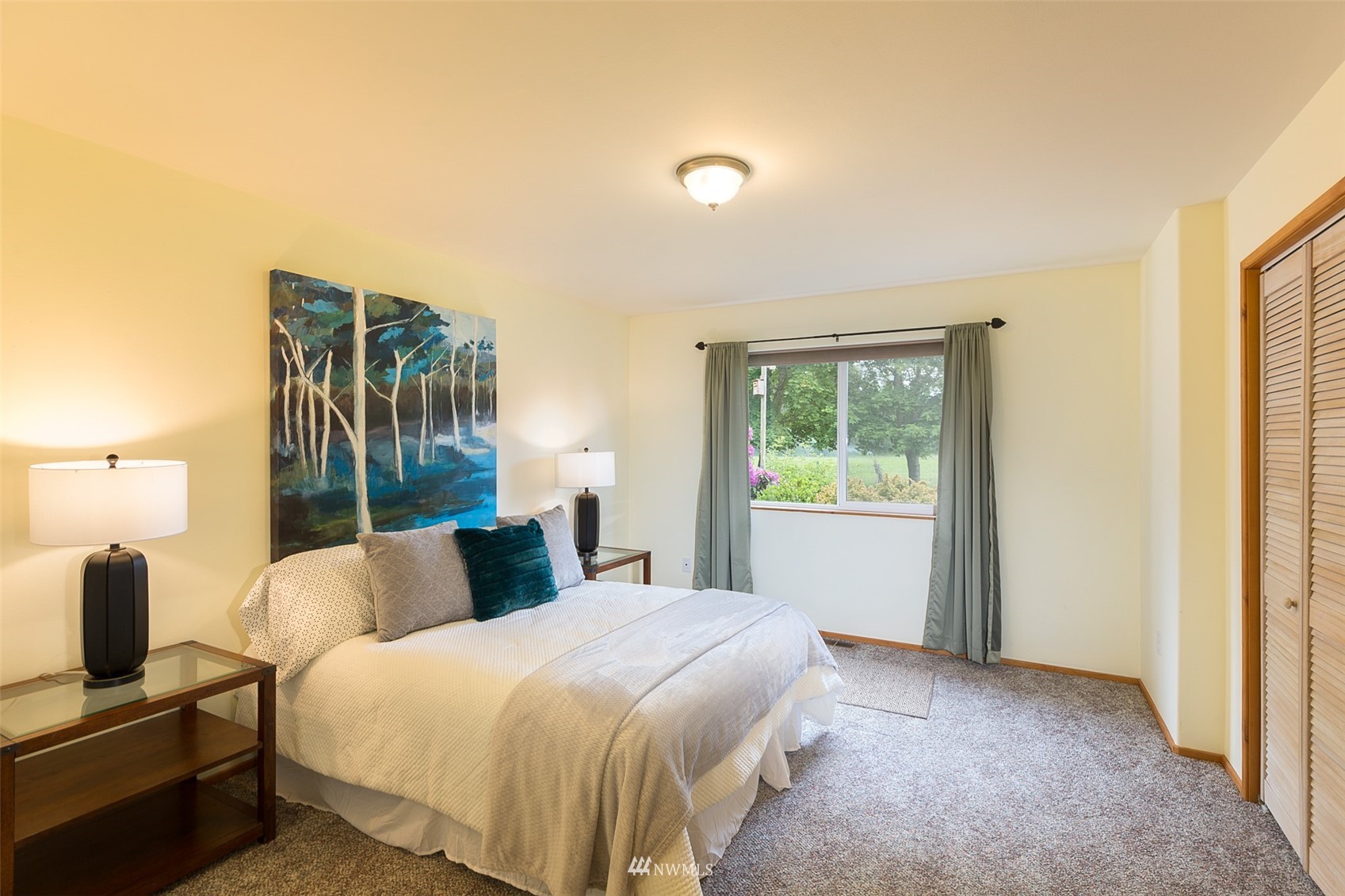 313 Applegate Lane Sequim, WA 98382 - Photo 21 of 40 a bedroom with a bed and a window