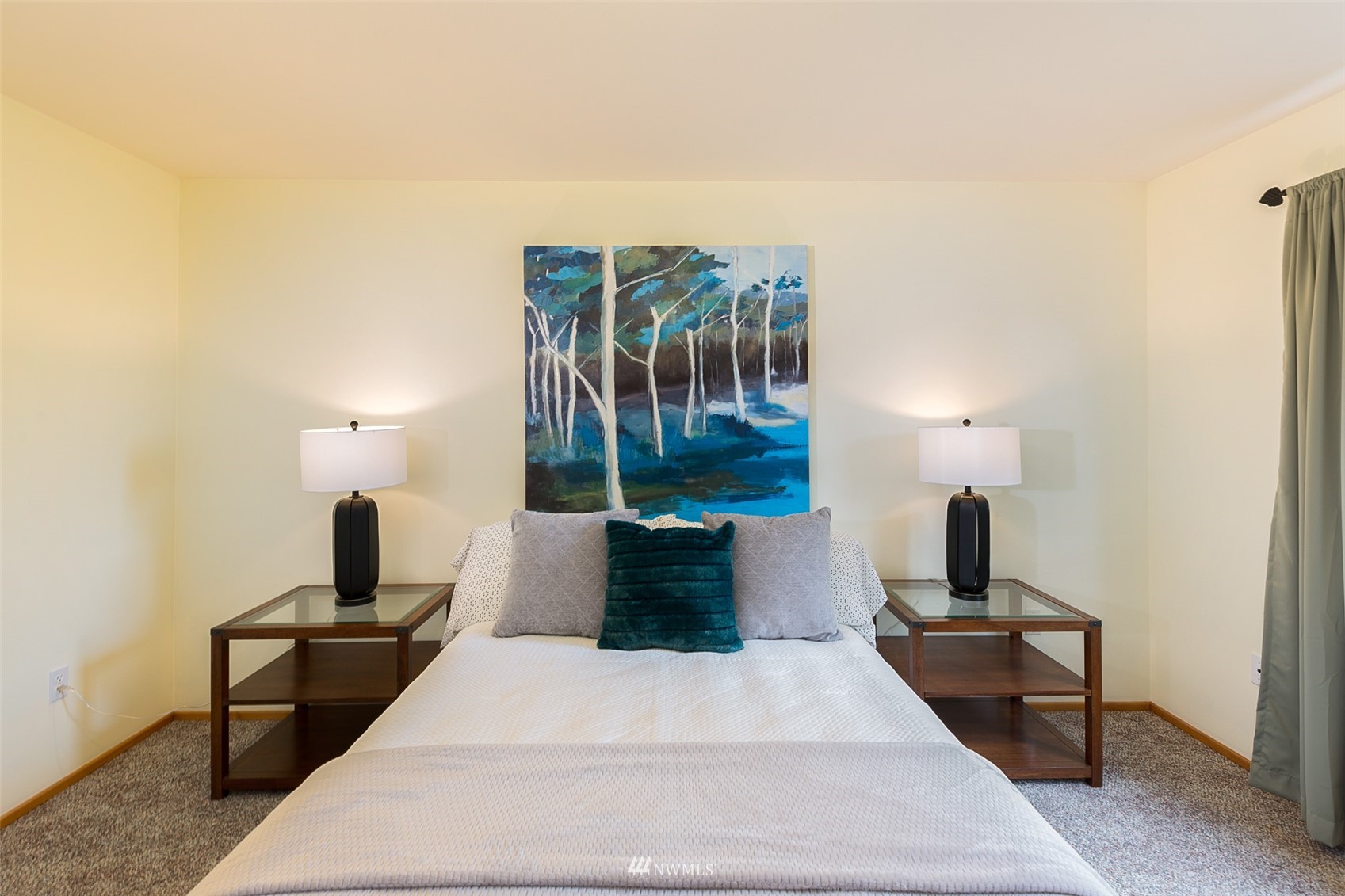 313 Applegate Lane Sequim, WA 98382 - Photo 22 of 40 a bedroom with a bed and a lamp