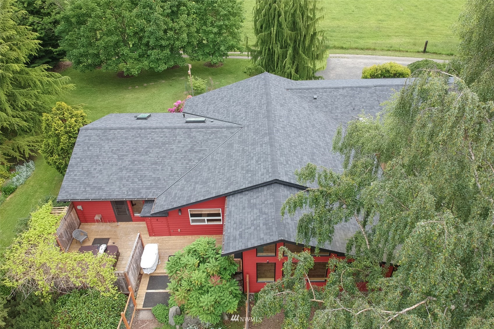 313 Applegate Lane Sequim, WA 98382 - Photo 28 of 40 an aerial view of a house with a yard basket ball court and outdoor seating
