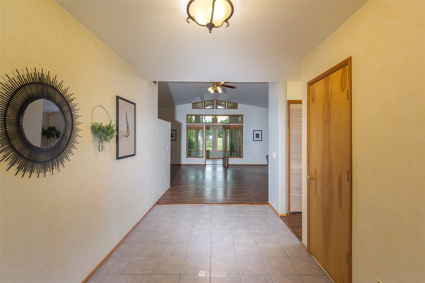 313 Applegate Lane Sequim, WA 98382 - Photo 3 of 40 a view of a hallway with entryway wooden floor and front door