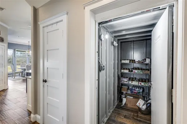 a kitchen with stainless steel appliances kitchen island granite countertop a table chairs stove and refrigerator