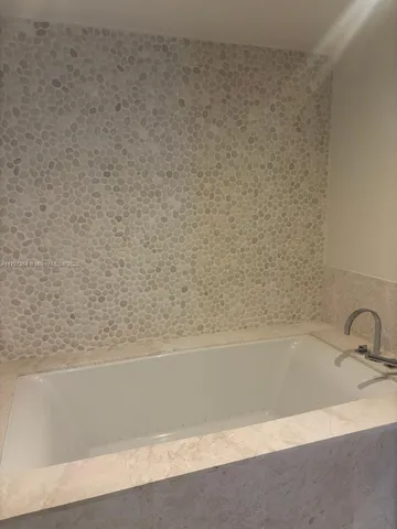 a bathroom with bathtub