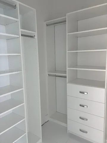 a view of an empty walk in closet