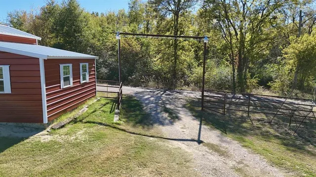 a view of house with a yard