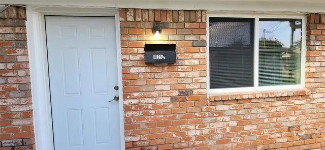 a view of empty room with windows
