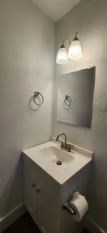 a bathroom with a sink and mirror