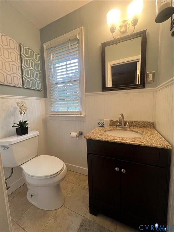 2307 Adelphi Road Henrico, VA 23229 - Photo 12 of 15 a bathroom with a toilet sink and mirror