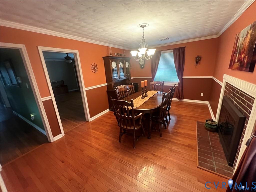 2307 Adelphi Road Henrico, VA 23229 - Photo 4 of 15 a view of a dining room with furniture window and wooden floor
