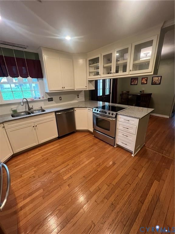 2307 Adelphi Road Henrico, VA 23229 - Photo 5 of 15 a kitchen with granite countertop a stove and cabinets