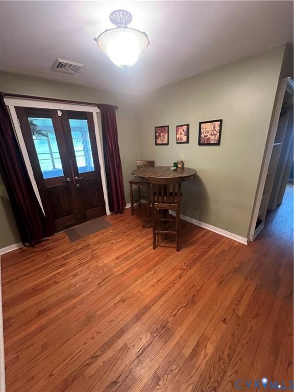 2307 Adelphi Road Henrico, VA 23229 - Photo 6 of 15 wooden floor and windows in a room