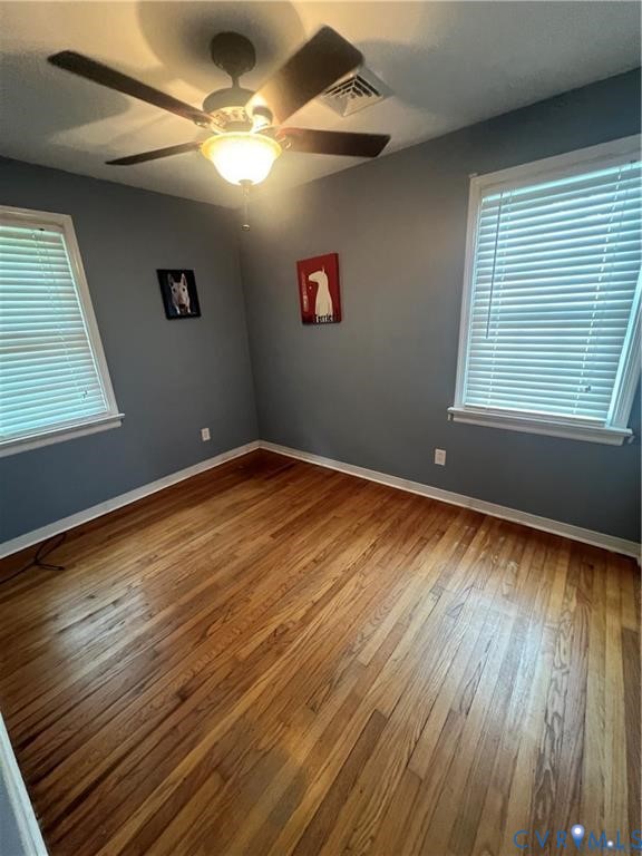 2307 Adelphi Road Henrico, VA 23229 - Photo 9 of 15 wooden floor in an empty room with a window