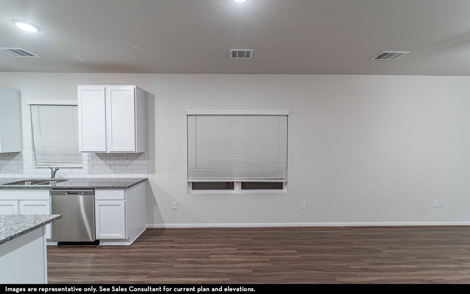 108 Zion Drive Kyle, TX 78640 - Photo 3 of 13 a view of a kitchen with wooden floor and a sink