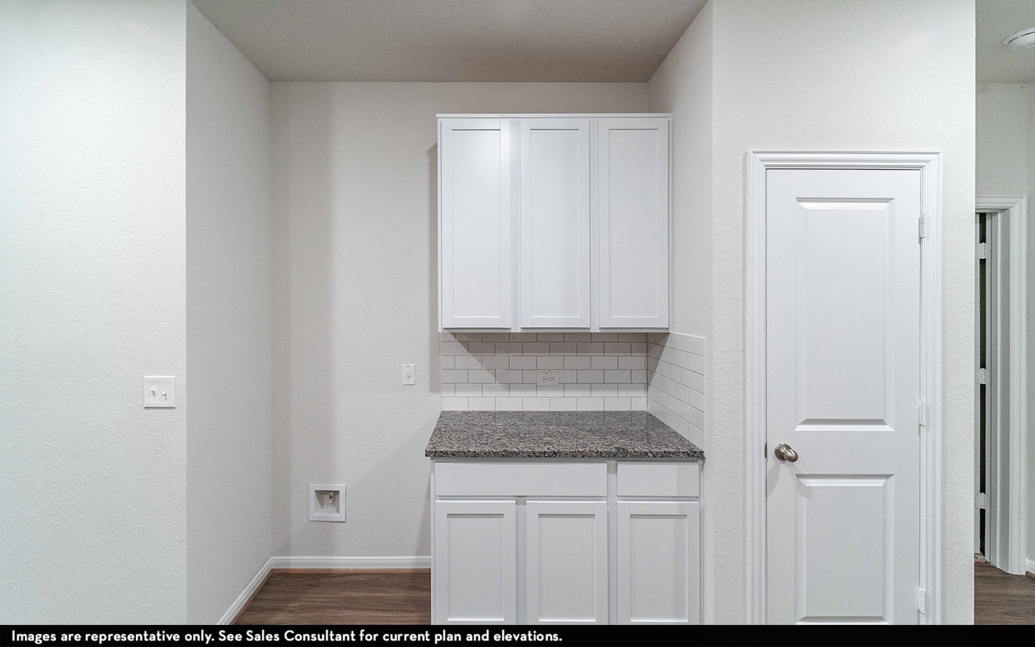 108 Zion Drive Kyle, TX 78640 - Photo 6 of 13 a bathroom with a granite countertop sink and white cabinets