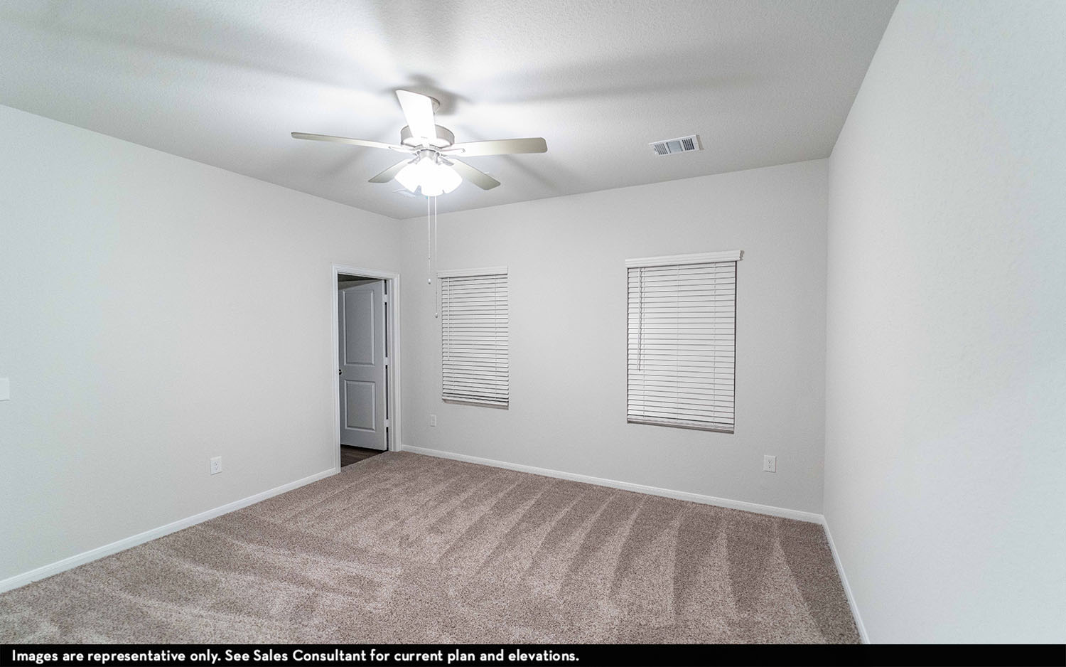 108 Zion Drive Kyle, TX 78640 - Photo 7 of 13 an empty room with windows and fan
