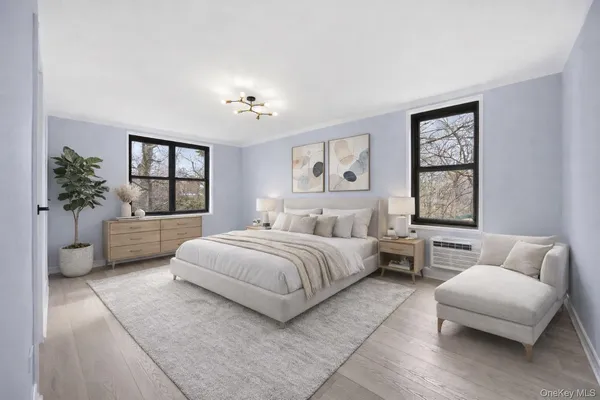 a spacious bedroom with a bed and a couch