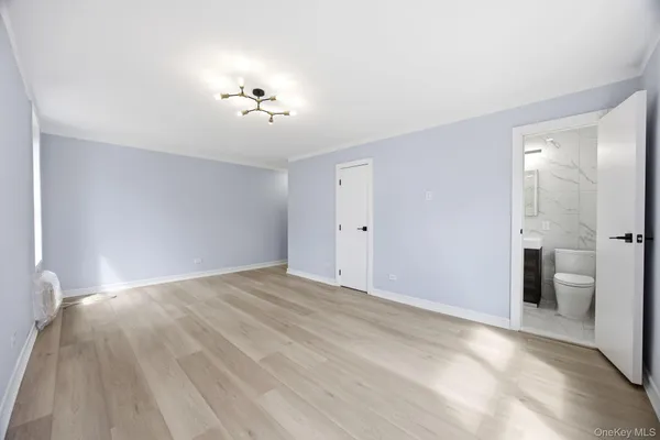 a view of an empty room with a bathroom