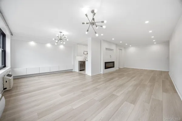 wooden floor in an empty room with a mirror