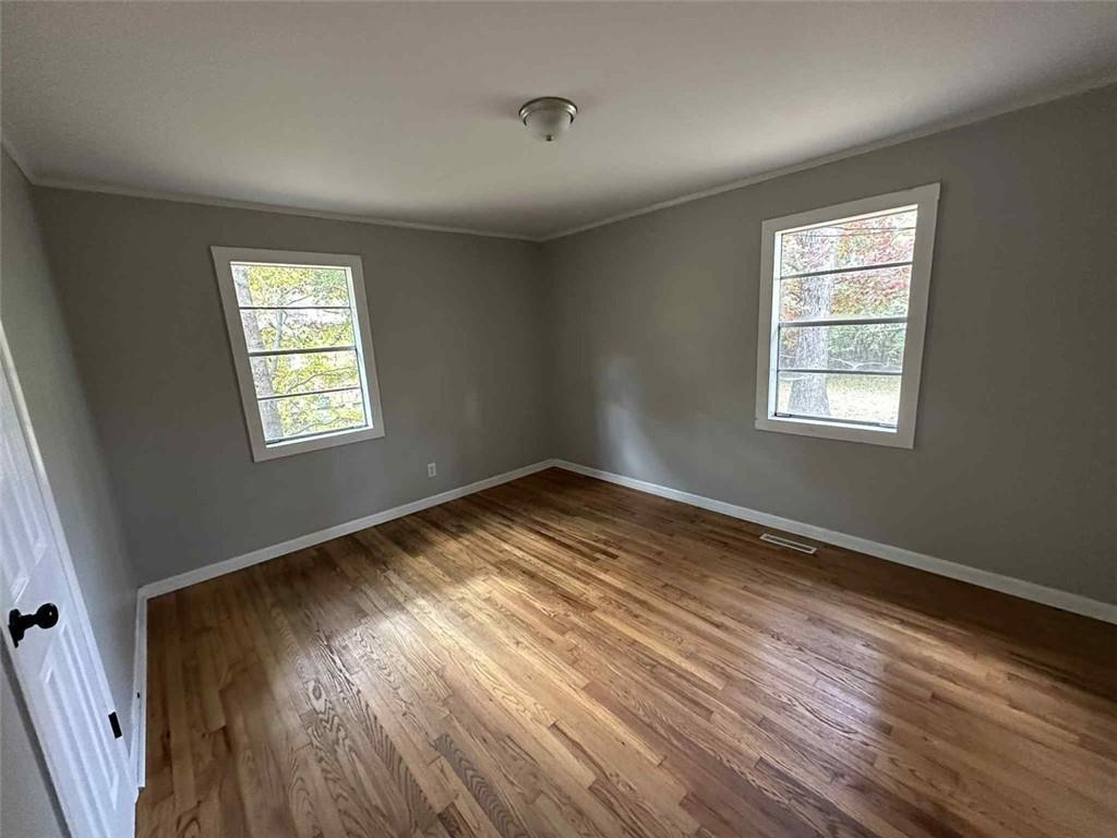 115 Mathis Drive Northwest Rome, GA 30165 - Photo 10 of 16 a view of empty room with wooden floor and fan