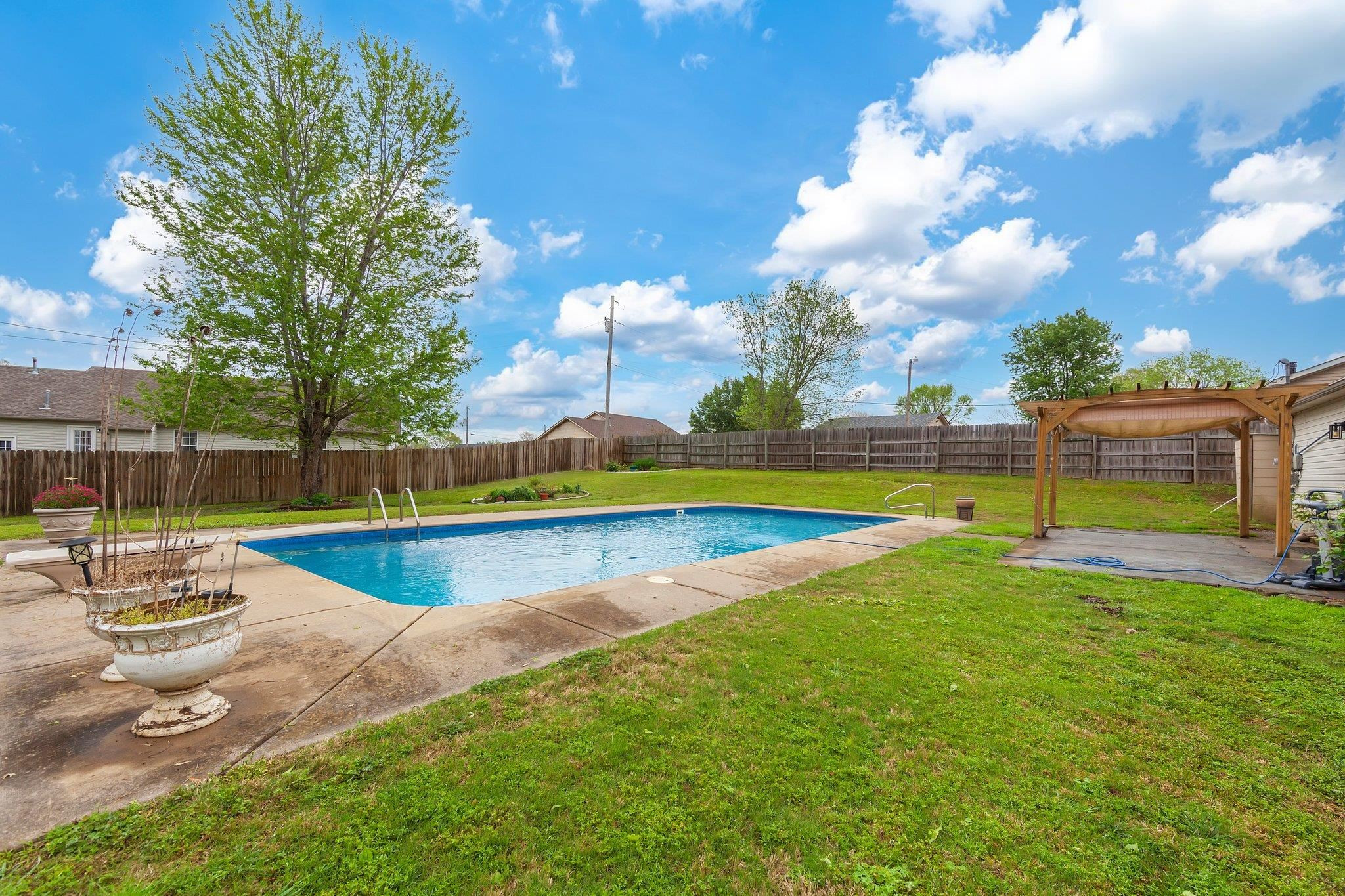 112 Penny Lane Jackson, TN 38301 - Photo 16 of 16 a view of a backyard with swimming pool