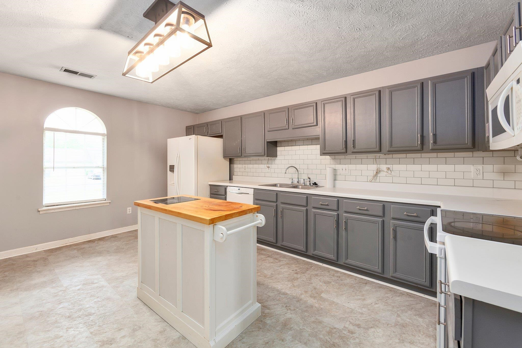 112 Penny Lane Jackson, TN 38301 - Photo 5 of 16 a kitchen with a cabinets and window